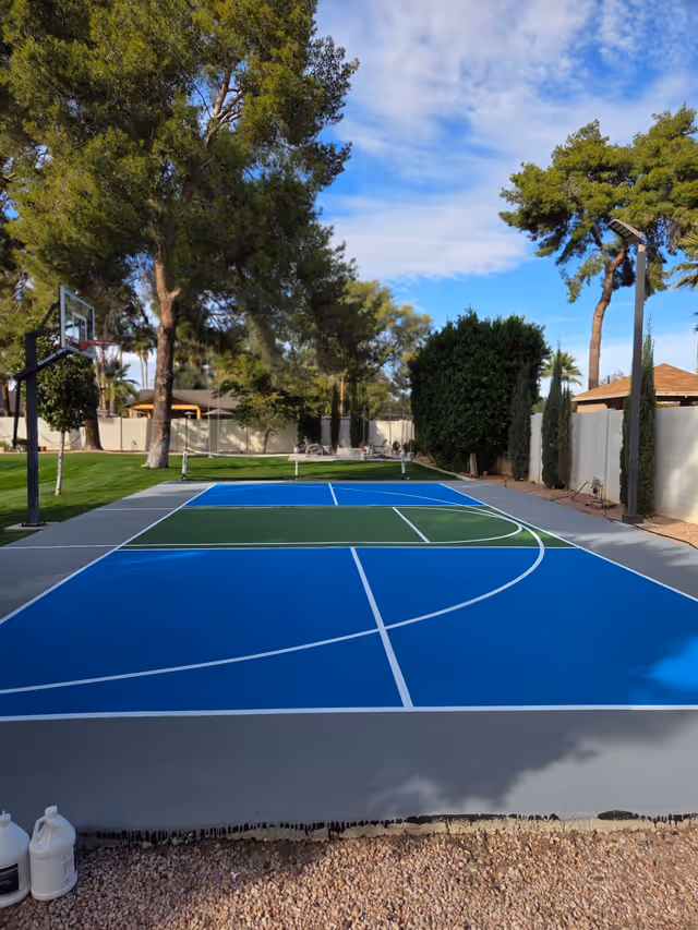 Backyard multi-sport court with basketball hoop, resurfaced by CORTZ in Arizona