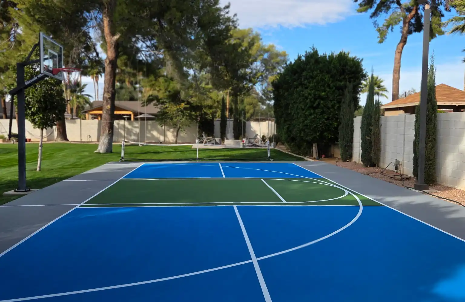 Finished backyard multi-sport court with basketball hoop in Queen Creek, Arizona