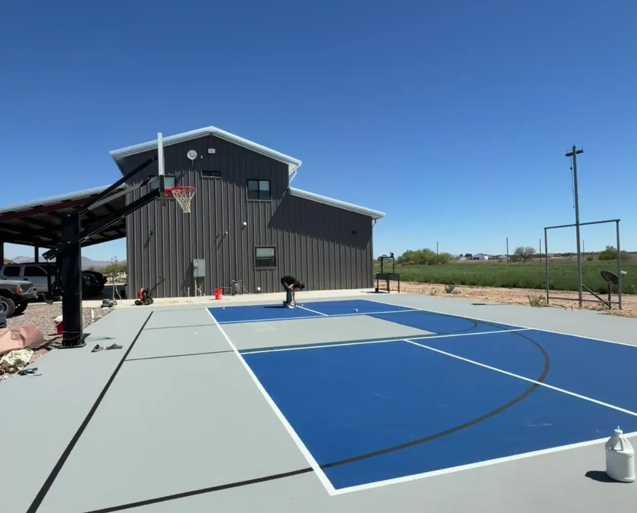 Basketball half-court beside a barn in Arizona