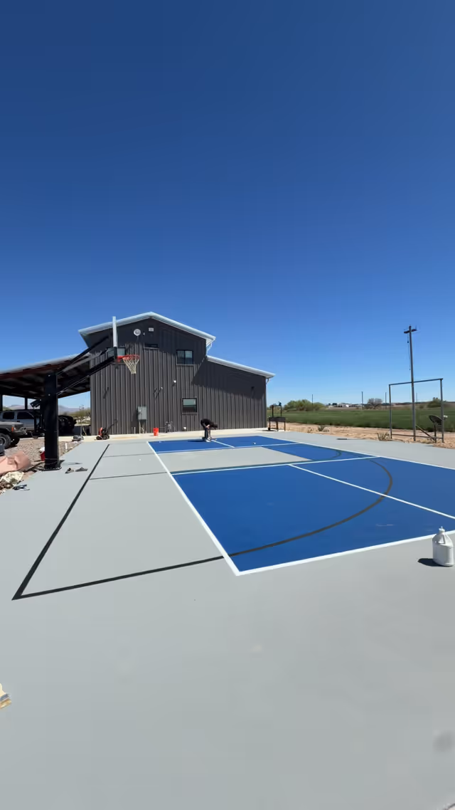 Basketball half-court beside a barn in Arizona