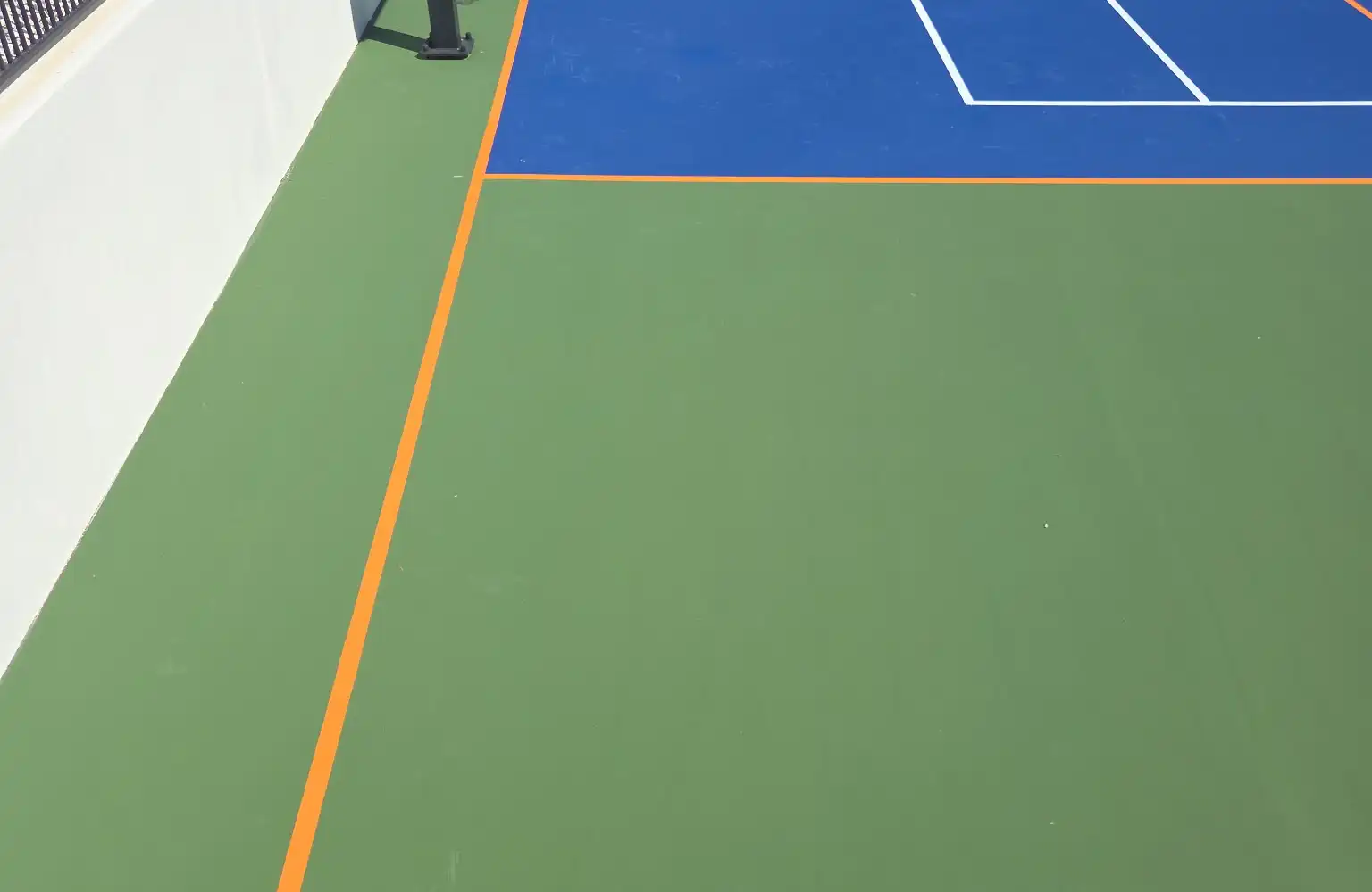 Multi-sport court with orange pickleball striping in Arizona