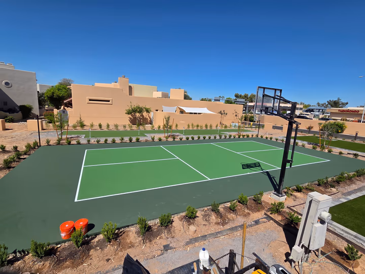Green tennis court after acrylic resurfacing in Arizona
